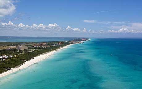 Varadero people and sailboats on the beach