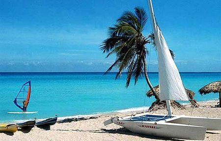 Varadero people and sailboats on the beach